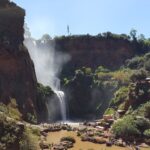 Waterfall Near Green Trees during Daytime